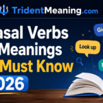 Phrasal Verbs and Meanings You Must Know in 2026 Learning phrasal verbs and meanings can feel confusing at first. A simple phrasal verb often carries a hidden idea. The words look easy, yet the phrasal verb meaning is not always literal. For example, “give up” does not mean giving something physically. Once you understand how phrasal verbs in English work, things start to make sense. You hear them everywhere. People use them in daily talk, movies, and online chats. Clear phrasal verbs examples help you see real usage. That makes learning easier and more practical. You start noticing patterns instead of guessing meanings. The good news is simple. You can learn step by step. Focus on common phrasal verbs and meanings first. Practice often in real sentences. Over time, it will feel natural. You will speak more confidently and understand everyday English much better. What Is a Phrasal Verb in English Grammar? A phrasal verb is a combination of a main verb and a small word like a preposition or adverb. Together, they create a new meaning. This meaning is often different from the original words. That’s why learners find them tricky at first. However, once you understand the pattern, they become easier to recognize and use in real situations. Simple Definition of Phrasal Verbs In simple terms, a phrasal verb joins two or more words to act like one verb. For example, “pick up” means to lift or collect something. The word “pick” alone has a different meaning. This is what makes phrasal verbs in English unique. You cannot always guess the meaning by looking at each word. That’s why learning with clear phrasal verbs examples helps a lot. Why Phrasal Verbs Matter in Daily English You hear phrasal verbs everywhere. People use them in daily talk, movies, and online chats. In fact, many common phrasal verbs appear in casual conversations. Without them, your English may sound too formal. They also help you express ideas naturally and clearly. When you practice phrasal verbs for daily conversation, your speaking becomes smoother and more confident. How to Conjugate Phrasal Verbs Correctly Conjugating a phrasal verb is easier than it looks. You only change the main verb. The second word stays the same. For example, “get up” becomes “got up” in the past. You don’t change “up.” This rule works for most english phrasal verbs. Once you understand it, you can use them in any tense without confusion. Tense Changes in Phrasal Verbs The tense depends on the main verb. For example: Present: I get up early. Past: I got up late yesterday. Present perfect: I have gotten up early this week. Notice how only the verb changes. The particle stays fixed. This makes phrasal verbs usage simple once you practice regularly. Common Mistakes in Conjugation Many learners try to change both words. That’s incorrect. Only the main verb should change. Another mistake is using the wrong tense form. For example, saying “I have get up” instead of “I have gotten up.” Small errors like these affect clarity. Regular phrasal verbs practice helps you avoid them and speak more naturally. Types of Phrasal Verbs Explained Clearly To understand phrasal verbs in english grammar, you need to know their types. They are grouped into categories based on how they behave in a sentence. This helps you use them correctly and avoid confusion. Once you learn the patterns, you can apply them easily in both speaking and writing. Overview of Phrasal Verb Categories There are two main pairs: Transitive and intransitive Separable and inseparable These groups explain how a phrasal verb works with objects. Some need an object, while others don’t. Some can split, while others must stay together. This structure is a key part of phrasal verbs rules. How to Identify Each Type Easily Start by checking if the verb needs an object. If it does, it’s transitive. If not, it’s intransitive. Next, see if you can split the verb and particle. If yes, it’s separable. If not, it’s inseparable. With time, these patterns become clear. Using a simple phrasal verbs study guide can make this process even faster. Transitive Phrasal Verbs with Examples Transitive phrasal verbs need an object to complete their meaning. Without an object, the sentence feels incomplete. These verbs are very common in daily speech. Many common phrasal verbs fall into this group. Once you understand them, your sentences become clearer and more natural. Definition of Transitive Phrasal Verbs A transitive phrasal verb is a verb that requires a direct object. For example, “pick up” needs something to act on. You can say, “pick up the bag.” Here, “the bag” is the object. This structure is an important part of phrasal verbs grammar rules. It helps you form correct and meaningful sentences. Example Sentences for Better Understanding Here are a few simple phrasal verbs examples: She picked up the phone quickly. They turned off the lights before leaving. He gave up the idea after thinking twice. These phrasal verbs examples in sentences show how the object completes the meaning. Practicing such sentences helps you build strong understanding and confidence. Intransitive Phrasal Verbs in English Intransitive phrasal verbs do not need an object. The sentence makes sense on its own. These verbs are simple to use and appear often in casual speech. Many learners find them easier than transitive ones. Meaning of Intransitive Phrasal Verbs An intransitive phrasal verb works without a direct object. For example, “wake up” can stand alone. You can say, “I wake up early.” There is no object needed. This makes them a key part of phrasal verbs explained simply for beginners. Common Usage Examples Here are some easy phrasal verbs for daily use sentences: I woke up late today. The meeting went on for hours. The car suddenly broke down. These phrasal verbs examples show how the sentence still feels complete without an object. Regular use will help you remember them naturally. Separable Phrasal Verbs and Their Rules Separable phrasal verbs let you split the verb and the particle. You can place the object between them or after them. This flexibility makes them useful in everyday speech. Many popular phrasal verbs follow this pattern. However, you need to know the rules to avoid mistakes. When to Separate the Verb and Particle You can separate the verb and particle when the object is a noun. For example, “pick up the book” or “pick the book up.” Both are correct. But with pronouns, you must separate them. You say “pick it up,” not “pick up it.” These are key phrasal verbs rules and examples you should remember. Examples of Separable Phrasal Verbs Here are some clear phrasal verbs examples: She turned off the light. / She turned the light off. He picked up the call. / He picked the call up. They cleaned up the room. / They cleaned the room up. These examples show how flexible phrasal verbs usage can be in real sentences. Inseparable Phrasal Verbs Explained Simply Inseparable phrasal verbs cannot be split. The verb and particle always stay together. You must place the object after the full verb. This rule is strict and easy to follow once you practice. Rules for Inseparable Phrasal Verbs With inseparable verbs, never break the phrase. For example, you say “look after the child,” not “look the child after.” These verbs follow fixed patterns. Many useful phrasal verbs belong to this group, so it’s important to learn them well. Common Examples You Should Know Here are some common phrasal verbs with examples sentences: She looked after the kids all day. They ran into an old friend. We came across a strange idea. These examples help you see how the structure stays the same every time. Word Order with Phrasal Verbs Made Easy Word order can change the meaning or correctness of a sentence. That’s why it’s important to understand how phrasal verbs behave. Once you learn the pattern, it becomes easy to apply in daily communication. Placement of Objects in Sentences With transitive verbs, the object can come after the verb or between the words. This depends on whether the verb is separable. For example, “turn off the light” and “turn the light off” are both correct. Learning this pattern improves your phrasal verbs in speaking and writing. Pronoun Rules with Phrasal Verbs Pronouns follow a strict rule. You must place them in the middle of separable verbs. For example, “pick it up” is correct. “Pick up it” is wrong. This is one of the most important phrasal verbs word order rules. Once you practice it, your sentences will sound natural and fluent. 100 Common Phrasal Verbs with Meanings and Examples Learning a strong phrasal verbs list helps you speak naturally. These verbs appear in daily conversations, emails, and casual writing. Instead of memorizing randomly, focus on the most common phrasal verbs first. This approach makes learning faster and more useful in real life. Most Used Phrasal Verbs in Daily Conversation Here is a short sample from a common english phrasal verbs list: Get up – to wake and leave bed Give up – to stop trying Run out of – to have no more of something Look after – to take care of someone Turn on – to start a device These are phrasal verbs commonly used in english. You hear them in daily talk all the time. Easy Examples to Learn Faster Simple sentences help you remember better. Try these phrasal verbs sentence examples easy: I got up early today. She gave up smoking last year. We ran out of milk. He looks after his younger brother. These examples show real phrasal verbs meaning and usage in context. Common Mistakes with Phrasal Verbs and How to Fix Them Mistakes happen when you guess meanings or forget structure. However, small fixes can improve your accuracy quickly. Errors Learners Often Make One common error is translating directly from your language. That doesn’t work with phrasal verbs. Another mistake is wrong word order. For example, saying “pick up it” instead of “pick it up.” Many learners also confuse similar verbs. Regular phrasal verbs exercises and consistent phrasal verbs and meanings can fix these issues over time. Phrasal Verbs vs Idioms: Key Differences Explained Phrasal verbs and idioms may look similar, but they are not the same. Understanding the difference helps you avoid confusion. How to Tell Them Apart Easily A phrasal verb acts like a verb and changes tense. For example, “give up” can become “gave up.” An idiom, however, is a fixed phrase. Its structure usually does not change. For example, “break the ice” stays the same. This simple idea is part of any clear phrasal verbs grammar explanation. Tips to Learn Phrasal Verbs Faster in 2026 Learning doesn’t have to feel overwhelming. With the right approach, you can phrasal verbs and meanings and use them with confidence. Smart Study Techniques That Work Start with basic phrasal verbs before moving to advanced phrasal verbs. Group them by theme, like travel or daily routine. Use them in sentences instead of memorizing lists. Try speaking them out loud. Also, follow simple phrasal verbs learning tips like practicing daily and reviewing often. Over time, your understanding will grow naturally. FAQ’s What are the 100 phrasal verbs with meaning and sentences? You can find full phrasal verbs and meanings lists with sentences in guides; focus on common phrasal verbs for daily use. What are 20 phrasal verbs with meaning? Twenty phrasal verbs meanings include get up, give up, look after, run out, turn on, each with simple meanings. What are the 40 phrasal verbs? Forty phrasal verbs usually cover daily use verbs like take off, break down, come back, and carry on. What are 10 phrasal verbs? Ten basic phrasal verbs meanings include get up, sit down, turn off, pick up, go out, come in. What is a phrasal verb with 50 examples? A phrasal verbs and meanings list with fifty examples helps you learn usage faster through real sentences and daily context. What are 20 examples of phrases with sentences? Twenty examples of phrases include common phrasal verbs and meanings used in sentences like give up, look after, and run out. What is a phrasal verb and its types? A phrasal verb combines a verb with a particle; phrasal verbs and meanings include transitive, intransitive, separable, and inseparable types. Conclusion Learning phrasal verbs and meanings takes time, but it becomes easier with practice. Each phrasal verb adds depth to your English. At first, the phrasal verb meaning may feel confusing. However, simple patterns help you understand better. When you study phrasal verbs in english, you begin to notice how often they appear in daily life. Clear phrasal verbs examples make learning faster and more enjoyable. You see how words connect in real situations. This helps you speak more naturally. Over time, phrasal verbs and meanings stop feeling difficult. Instead, they become part of your everyday language. Small steps and regular practice bring steady progress. Keep practicing daily and stay consistent. Focus on common phrases first. Then move to more advanced ones. With effort, phrasal verbs and meanings will feel easy. You will use each phrasal verb with confidence. In the end, your English will sound more fluent and natural. Meta Description Master phrasal verbs and meanings with simple rules, real examples, and daily usage tips that make learning English faster and easier.